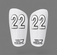A pair of TREDCAL brand soccer shin guards with patented 3D number in arial font.