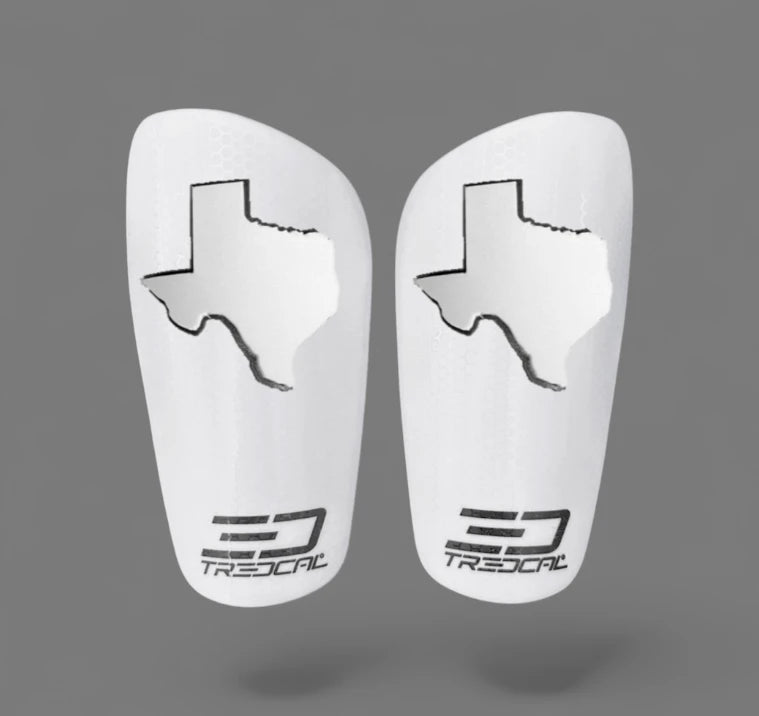 Pair of white soccer shin guards with any 3D state logo on TREDCAL brand guards