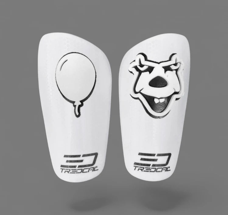 A pair of TREDCAL brand soccer shin guards with patented 3D clown and balloon logo.
