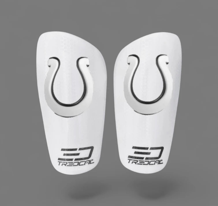 A pair of TREDCAL brand soccer shin guards with patented 3D horse shoe logo.