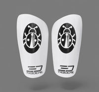 A pair of TREDCAL brand soccer shin guards with patented 3D lady bug logo.