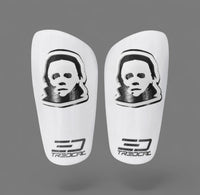 A pair of TREDCAL brand soccer shin guards with patented 3D Mask logo.