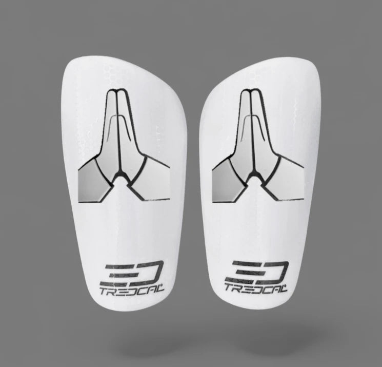 Pair of white prayer hands shin guards with TREDCAL lack branding