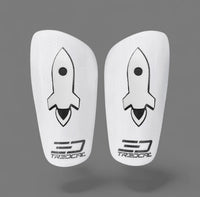 Pair of white shin guards with 3D rocket design on TREDCAL shin guards