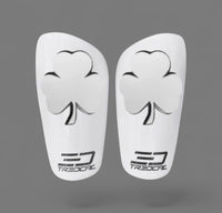 A pair of TREDCAL brand soccer shin guards with patented 3D shamrock logo.