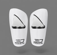 A pair of TREDCAL brand soccer shin guards with patented 3D shark fin logo.