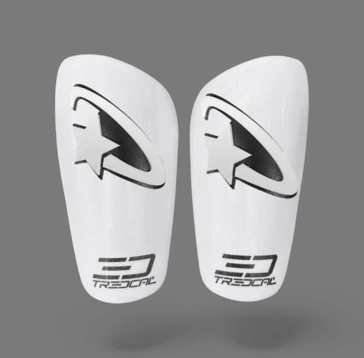 Pair of white soccer shin guards with 3D shooting star design on Tredcal brand shin guards