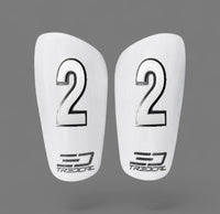A pair of TREDCAL brand soccer shin guards with patented 3D single digit numbers on each guard in arial font.