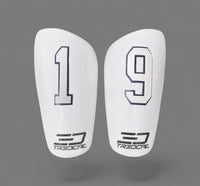 A pair of TREDCAL brand soccer shin guards with patented 3D single digit number on each guard in varsity font.