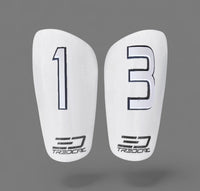 Pair of white shin guards with 3D white and black numbering and TREDCAL branding