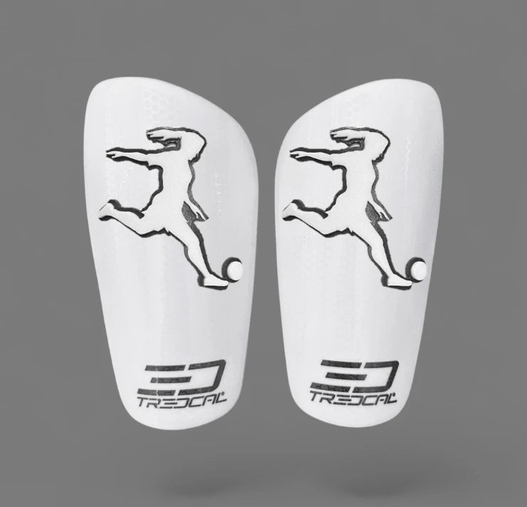 A pair of TREDCAL brand soccer shin guards with patented 3D soccer player logo.