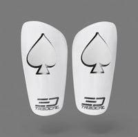 A pair of TREDCAL brand soccer shin guards with patented 3D spades logo.