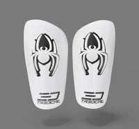 A pair of TREDCAL brand soccer shin guards with patented 3D spider logo.