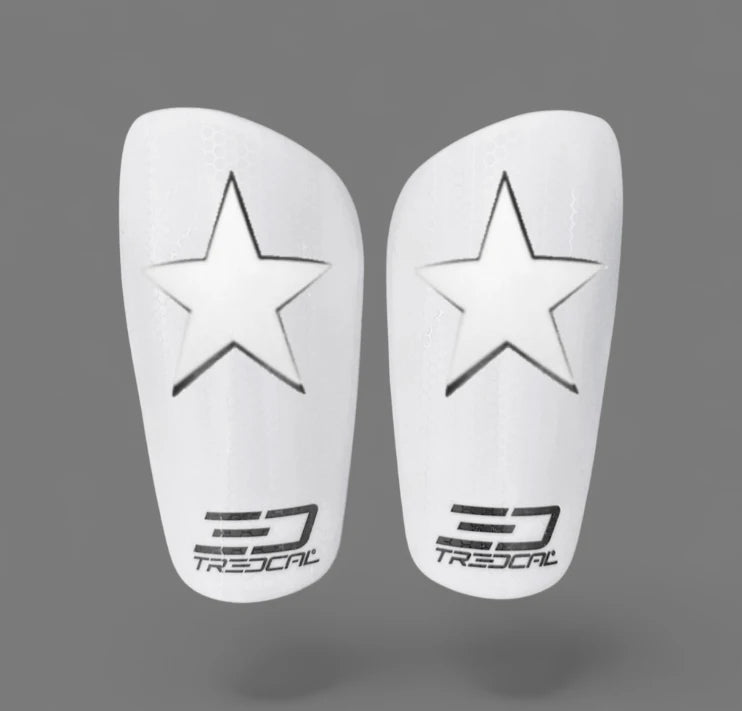 A pair of TREDCAL brand soccer shin guards with patented 3D star logo.